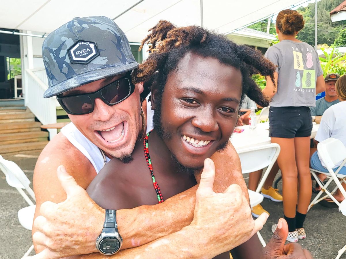 Scott Uncle Savage Minkler and a student smiling after a surf session