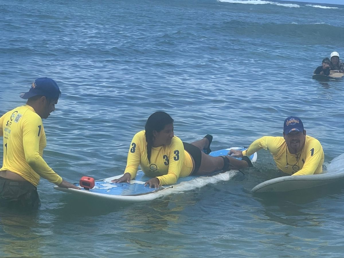 SFC students training their paddle strokes in calm Waikiki water