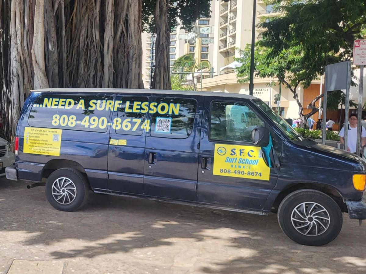 The marked SFC Surf School van near Ala Wai Boat Harbor