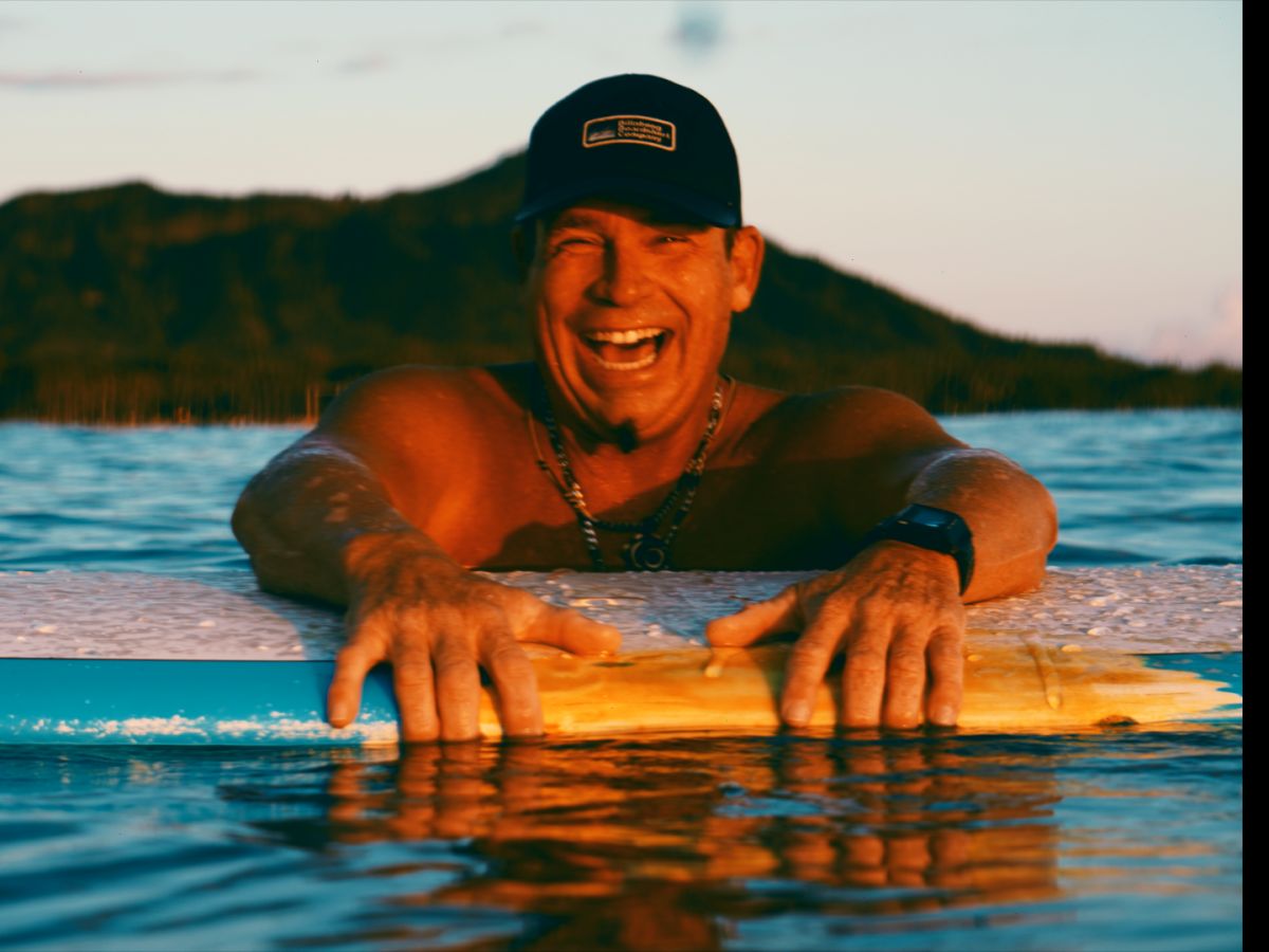 A surfer holding a board in the water during an SFC session